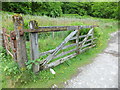 A derelict gate that says "Railway" in Minera Community