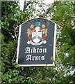 Sign for the Aikton Arms public house in Aikton
