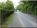 Looking east on Folders Lane to the railway bridge in RH15 0US