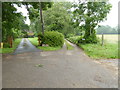 Drives diverge west of Wellhouse Farm in RH15 0BG