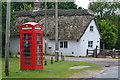 Telephone box and thatched cottage at Norleywood in SO41 5RU