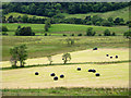 Grass baling in valley between Great Mell Fell and Little Mell Fell in CA11 0SA