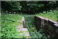 Overgrown lock on the disused Somerset Coal Canal in BA2 7EE