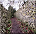 Public footpath between drystone walls, Minchinhampton in GL6 9HL