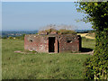 Pillbox near a field boundary west of RAF Yatesbury in SN11 8YD