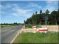 The B1150 (North Walsham Road) past Tithe Plantation in Beeston St. Andrew