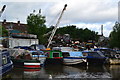 Jumble of boats and rubbish beside the Coventry Canal at Bedworth in CV12 9DX