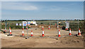 Security fencing at road construction site in NR10 3JF