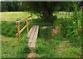 Footbridge over a stream, near Burford, Oxon in OX18 4DU
