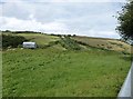View from Woodhuish Lane up the hill to Southdown Barns in TQ5 0HE