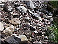 Chaotic jumble of rocks and gravel in SA9 2QL