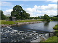 A Weir And Flood Defences On The Derwent in Portinscale