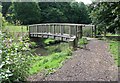 Wooden bridge over stream running through Springhead Park in LS26 0EY