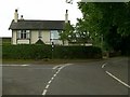 Road junction at the Harrington Arms, Gawsworth in SK11 9RR