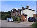 Last houses on Telegraph Lane near Slough Farm in KT10 9DH