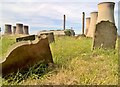 Fallen gravestones in old graveyard at West Burton in West Burton