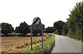 Honingham Road and Weston Longville village name sign in NR9 5JU