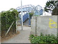 Twitten approaches pedestrian bridge over railway in BN41 2AB