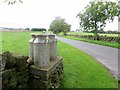 Milk churns awaiting collection in LA2 8LS