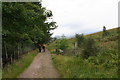 Walkers approaching Drochaid Easain Duibh on the West Highland Way north of Forest Lodge in PA36 4AH
