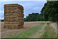 Tower of bales beside footpath near Sopley in BH23 7BD