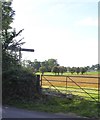 Signpost and gate at Lake Cross in EX16 7NA