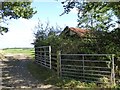 Two gates and a farm building near Highwood Farm in EX16 7QH