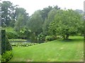 Lake and gardens at Holcombe Court in heavy rain in TA21 0NR