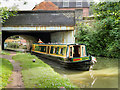 Narrowboat at Weedon Station Bridge in Weedon Bec