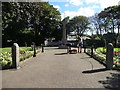 The war memorial and two dog lovers in Formby in L37 4AB