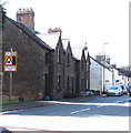 Maximum speed 20 when lights flash, High Street, Aylburton in GL15 6DA