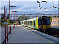 A class 350 electric train departing from Stafford in ST17 9YL