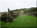 Rievaulx Abbey with village and Rievaulx Bank beyond in YO62 5LB