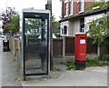 Elizabeth II postbox and telephone box outside Post Office, Grimsargh in PR2 5JR