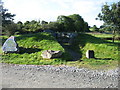 A reconstructed burial chamber in the car park for Bryn Celli Ddu in Llanddaniel Fab Community
