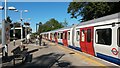 Wimbledon-bound District line train at Southfields station in SW19 6SP