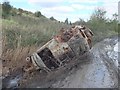 Burned out vehicle at Bickershaw slag heaps in WN7 4RP