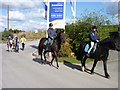 Horse riders passing entrance of new development in WR7 4FG