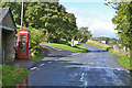 Road junction and telephone box, Bampton in CA10 2RS