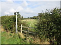 Stile and footpath across Harmston Park in LN5 9SU