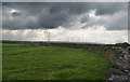 A wall, a wind farm and a threatening sky in BB5 3SG