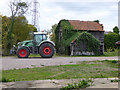 Tractor and aged farm building in Bradwell-on-Sea