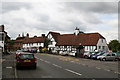 Car lot and old cottages, High Street, Eynsford, Kent in DA4 0AZ