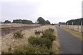 Railway and path passing Barry Buddon in DD7 7SA