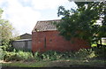 Farm buildings on SE side of Coddington Road in NG24 3NE