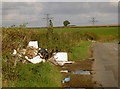 Two piles of rubbish in SN14 8HY