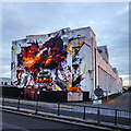 Littlewood Building with mural at sundown, Edge Lane, Liverpool in L7 9PW
