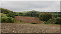 Ploughed field in a narrow valley in BS39 4NT