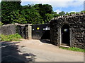 Wall and locked gates at the edge of a quarry, Dinas Powys in CF64 4AQ