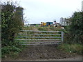 Gated farm track off Warmingham Road in Warmingham